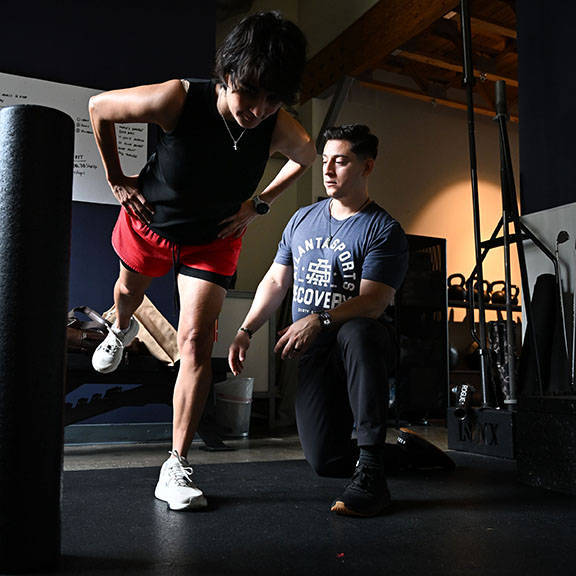 Runner receiving physical therapy treatment for knee injury at Decatur sports recovery clinic