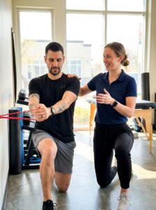 Patient working with a provider at a performance physical therapy clinic in Decatur
