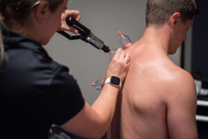  Patient working with a provider at a performance physical therapy clinic in Decatur, GA