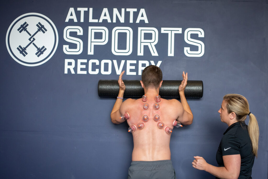 athlete working with physical therapist on movement assessment