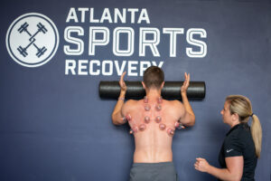 athlete working with physical therapist on movement assessment